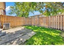 View of yard featuring cooling unit and a patio area