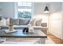 Living room with hardwood / wood-style flooring