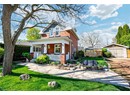 Traditional style home with brick siding and a porch
