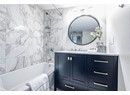 Bathroom with vanity and tiled shower / bath combo