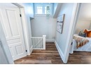 Hallway with dark hardwood / wood-style floors