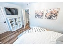 Bedroom with dark hardwood / wood-style floors