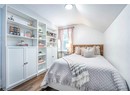 Bedroom featuring dark hardwood / wood-style floors and vaulted ceiling