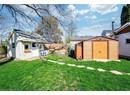 View of yard featuring an outbuilding and a shed