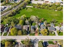 View of property location with nearby suburban area