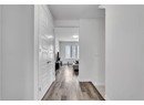 Hall featuring light wood-type flooring