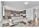 Living room with hardwood / wood-style floors and sink