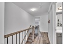 Corridor featuring light hardwood / wood-style flooring and a textured ceiling