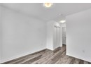 Unfurnished room featuring wood-type flooring and a textured ceiling