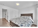 Bedroom featuring hardwood / wood-style flooring, a closet, and a textured ceiling