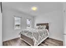 Bedroom featuring hardwood / wood-style floors and a textured ceiling