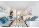 Living area featuring recessed lighting, wood finished floors, and ornamental molding