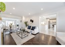 Living area featuring ornamental molding, light wood-style floors, and recessed lighting