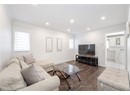 Living area with baseboards, crown molding, dark wood-type flooring, and recessed lighting