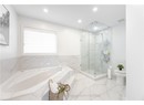Full bath featuring a bath, a marble finish shower, toilet, recessed lighting, and marble finish floor