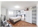Bedroom featuring baseboards and a textured ceiling