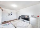 Bedroom featuring baseboards, a textured ceiling, and visible vents