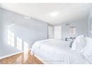 Bedroom with baseboards, visible vents, and a textured ceiling