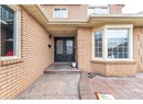 Property entrance with brick siding