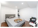 Bedroom with baseboards, wood finished floors, and recessed lighting