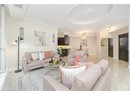 Living room featuring ornamental molding, baseboards, and visible vents