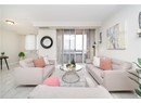 Living room featuring baseboards, visible vents, and crown molding
