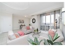 Living room featuring baseboards, visible vents, ornamental molding, and light tile patterned floors