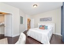 Bedroom featuring baseboards and wood finished floors