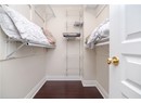 Spacious closet with wood finished floors