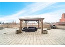 View of patio / terrace with fence, a gazebo, an outdoor living space with a fire pit, and area for grilling