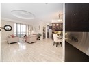 Living area featuring baseboards and ornamental molding