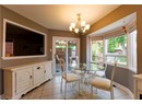 Dining space with a chandelier and light tile patterned flooring