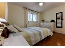 Bedroom with ceiling fan and baseboards