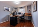 Office space featuring a textured ceiling and wood finished floors