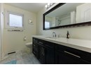 Full bath featuring vanity and a shower with shower curtain
