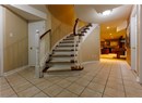 Stairs featuring tile patterned floors and recessed lighting