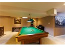 Playroom with light carpet and billiards table