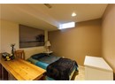 Bedroom featuring light carpet and recessed lighting