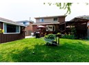 Back of house featuring a patio area, brick siding, and a pergola