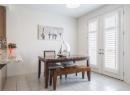 Dining space with french doors and light tile patterned flooring