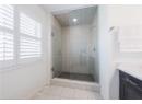 Bathroom featuring a shower stall, vanity, and tile patterned floors