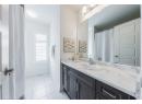 Bathroom with vanity and tile patterned flooring