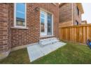 Entrance to property featuring brick siding and french doors