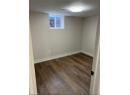 Below grade area featuring dark wood-style floors
