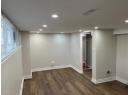 Basement featuring wood finished floors and recessed lighting