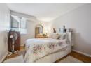 Bedroom featuring baseboards and a textured ceiling