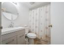 Full bathroom with vanity and a shower with curtain