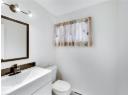 Bathroom with vanity and baseboard heating