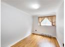 Spare room with light wood-type flooring, baseboard heating, and ornamental molding