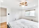 Bedroom featuring light wood-style flooring, ceiling fan, recessed lighting, and ornamental molding